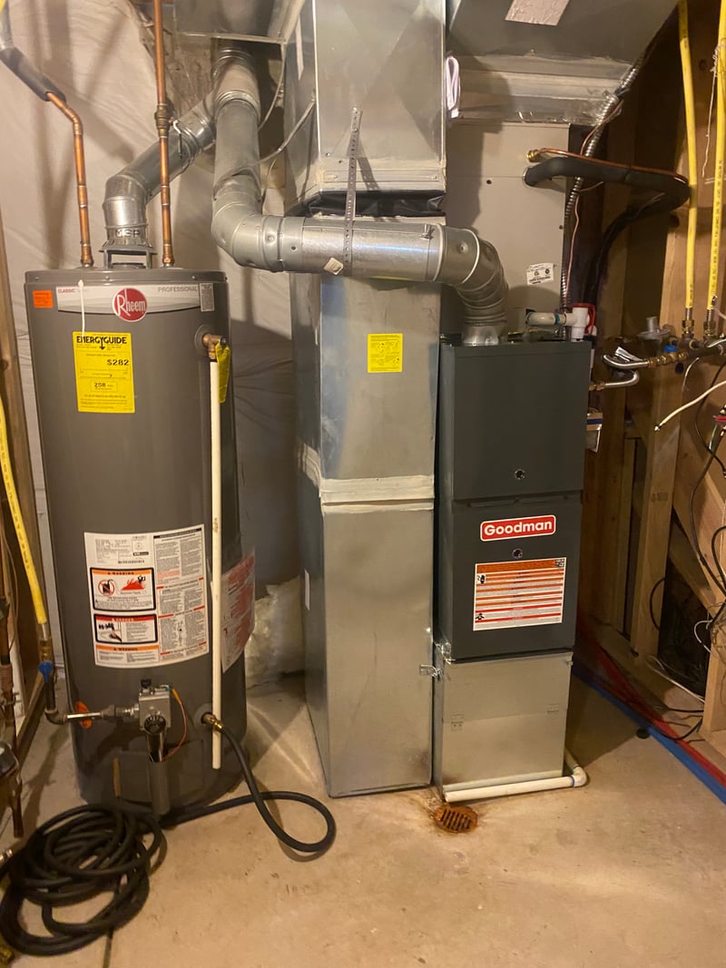 Attic-installed Daikin gas furnace with insulated flex return and tightly routed refrigerant lines.