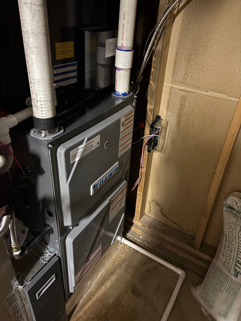 Daikin gas furnace and evaporator package installed in an attic mechanical space with sealed joints.