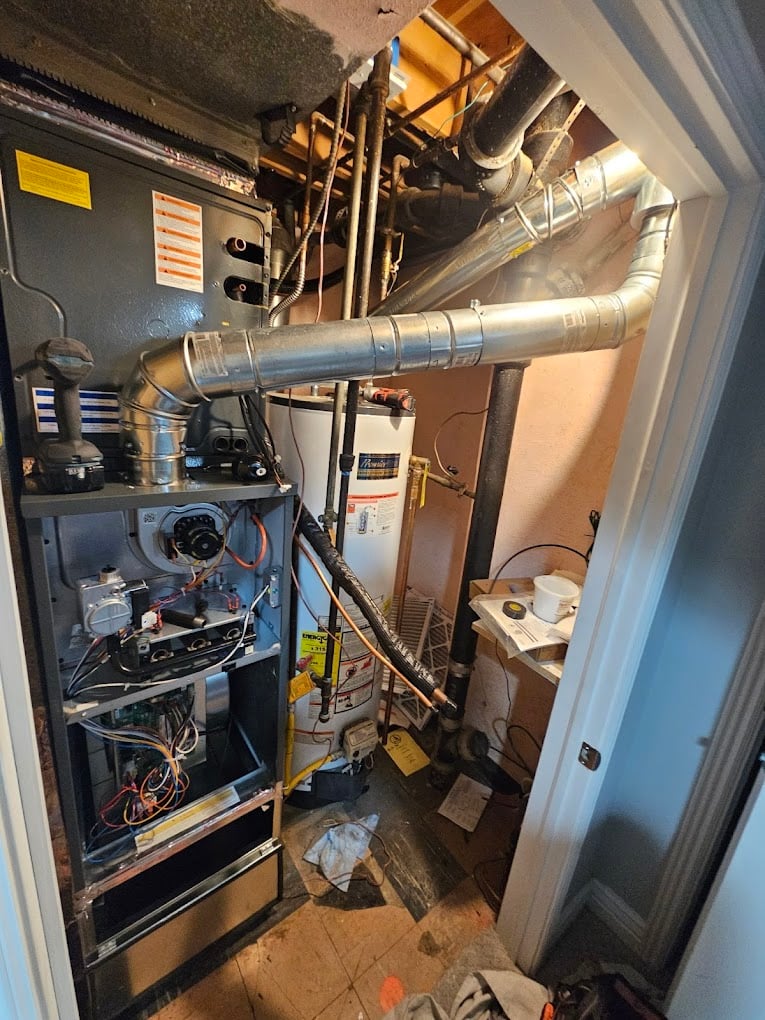 Newly installed furnace with a clean, code-compliant vent connection and drain routing.