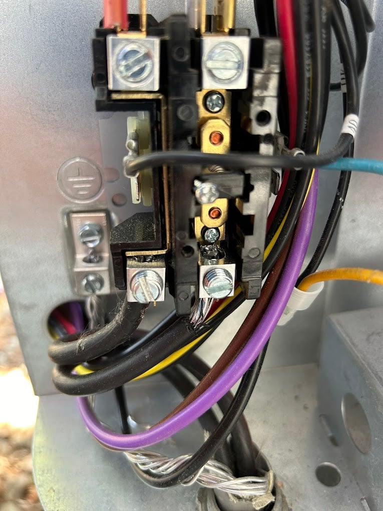 Anchored copper refrigerant line-set and PVC condensate drain running down a new mini-split install.