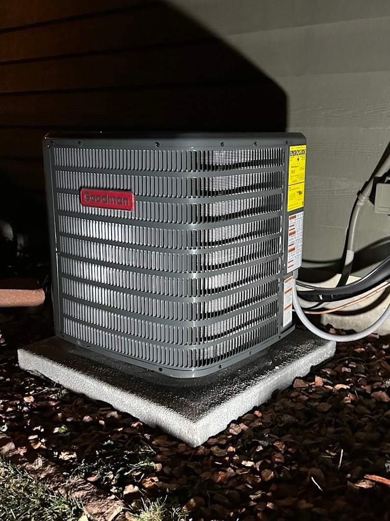 Neatly routed refrigerant line-set and PVC drainage on a newly installed mini-split system.