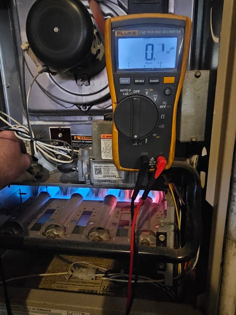 Mini-split line-set and condensate lines routed cleanly through a utility nook during installation.